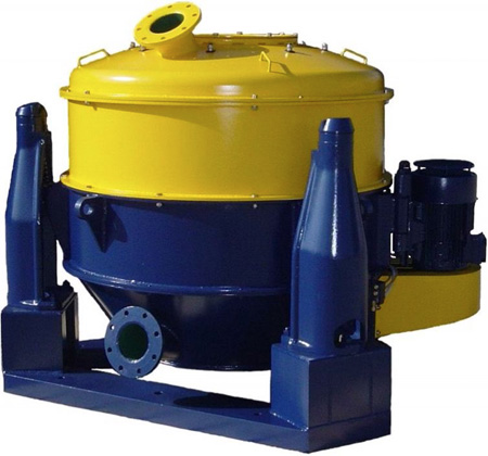 Decanter centrifuge with automatic bottom discharge, with elevated platform and solids receiving sack.